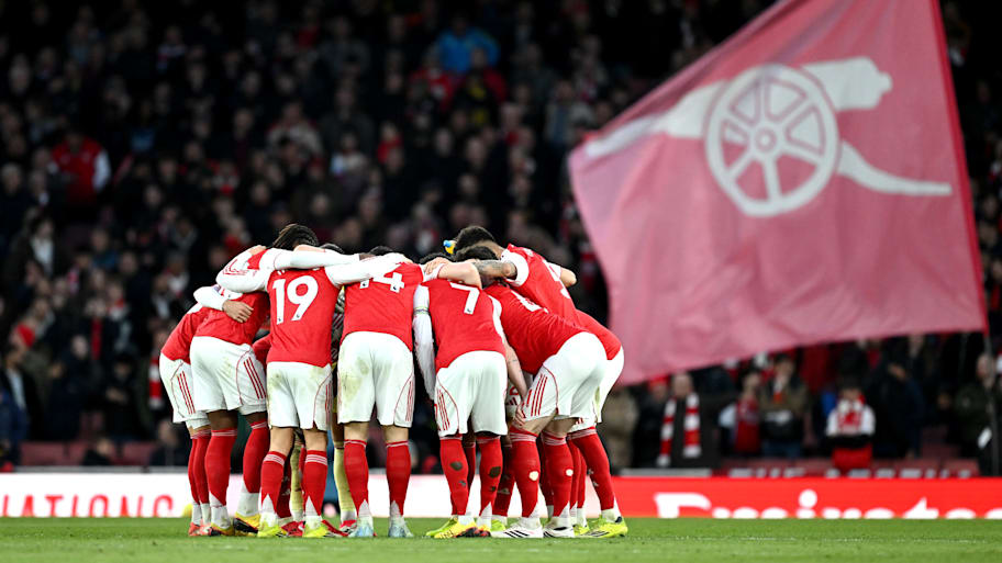 Arsenal huddle. 