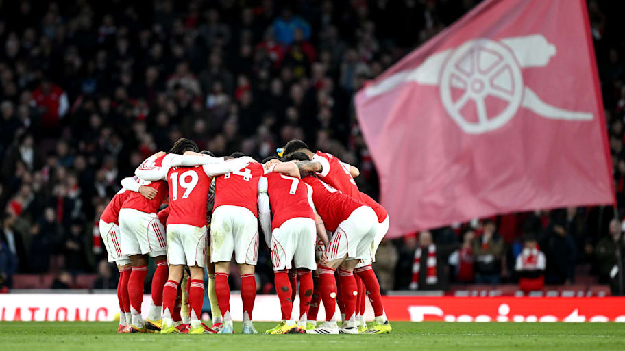Arsenal huddle. 