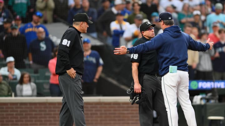 Seattle Mariners manager Scott Servais (9) argues with home plate umpire Chris Guccione (68) after catcher Cal Raleigh (29) (not pictured) struck out during the eighth inning against the Chicago White Sox at T-Mobile Park on June 10.