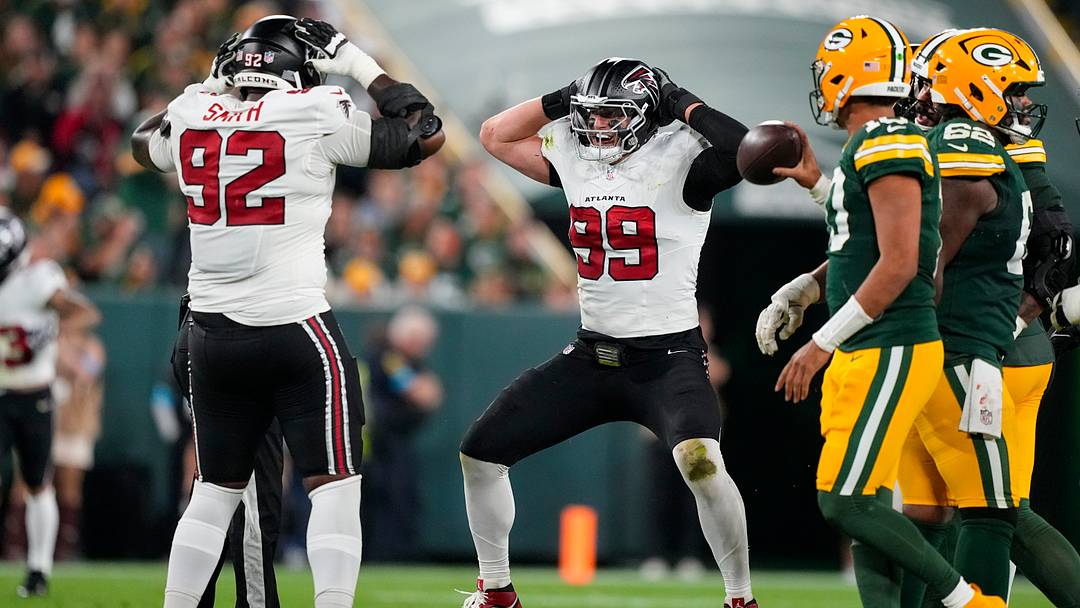 Sep 24, 2026; Green Bay, Wisconsin, USA;  Atlanta Falcons defensive end Cameron Thomas (99) celebrates with defensive lineman Maason Smith (92) after tackling Green Bay Packers quarterback Jordan Love (10) (not pictured) during the third quarter at Lambeau Field. Mandatory Credit: Jeff Hanisch-Imagn Images