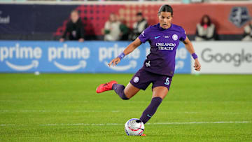 Nov 23, 2024; Kansas City, Missouri, USA; Orlando Pride defender Emily Sams (6) dribbles the ball against the Washington Spirit during the second half in the 2024 NWSL Championship match at CPKC Stadium. Mandatory Credit: Denny Medley-Imagn Images