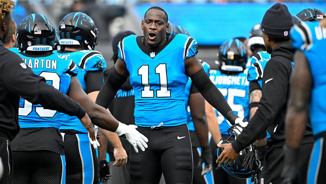 Oct 26, 2025; Charlotte, North Carolina, USA; Carolina Panthers linebacker Nic Scourton (11) runs on to the field before the game at Bank of America Stadium. Mandatory Credit: Bob Donnan-Imagn Images