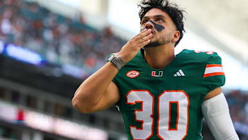 Former Miami Hurricanes placekicker and New England Patriots draft pick Andres Borregales (30) blows a kiss before the game against the Wake Forest Demon Deacons at Hard Rock Stadium.