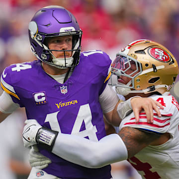 Sep 15, 2024; Minneapolis, Minnesota, USA; San Francisco 49ers defensive end Yetur Gross-Matos (94) tackles Minnesota Vikings quarterback Sam Darnold (14) in the third quarter at U.S. Bank Stadium. Mandatory Credit: Brad Rempel-Imagn Images