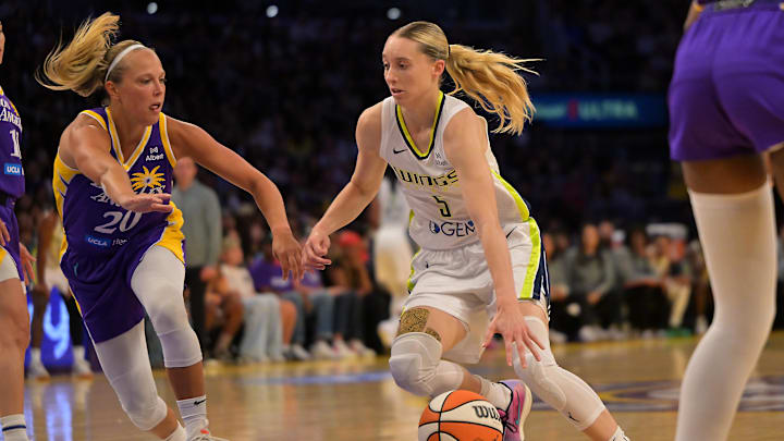 Los Angeles Sparks guard Julie Allemand defends Dallas Wings guard Paige Bueckers. Los Angeles Sparks guard Julie Allemand defends Dallas Wings guard Paige Bueckers.