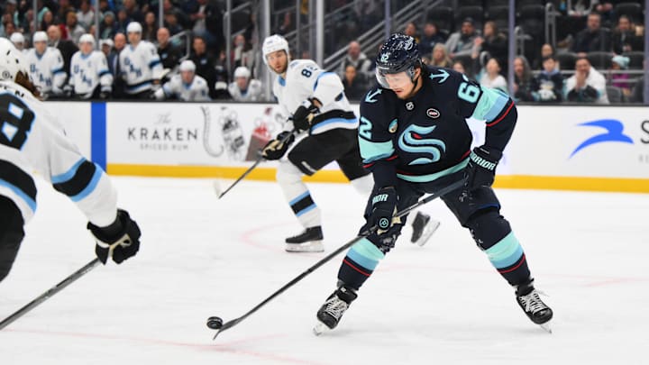 Mar 14, 2025; Seattle, Washington, USA; Seattle Kraken defenseman Brandon Montour (62) passes the puck during the second period against the Utah Hockey Club at Climate Pledge Arena. Mandatory Credit: Steven Bisig-Imagn Images