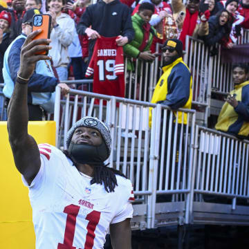 Dec 31, 2023; Landover, Maryland, USA; San Francisco 49ers wide receiver Brandon Aiyuk (11) celebrates with fans after defeating the Washington Commanders at FedExField. Mandatory Credit: Brad Mills-USA TODAY Sports
