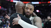 Jan 28, 2025; Portland, Oregon, USA; Portland Trail Blazers head coach Chauncey Billups embraces Milwaukee Bucks point guard Damian Lillard (0, right) after a game at Moda Center. Mandatory Credit: Soobum Im-Imagn Images
