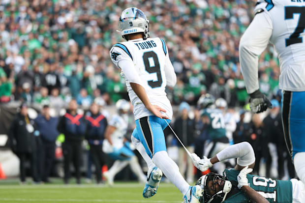 Carolina Panthers quarterback Bryce Young (9) escapes the tackle attempt of Philadelphia Eagles linebacker Josh Sweat
