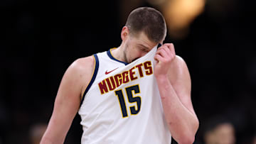 Mar 2, 2025; Boston, Massachusetts, USA; Denver Nuggets center Nikola Jokic (15) reacts during the second half against the Boston Celtics at TD Garden. Mandatory Credit: Paul Rutherford-Imagn Images
