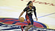 Nov 5, 2025; Cleveland, Ohio, USA; Cleveland Cavaliers guard Darius Garland (10) brings the ball up court in the fourth quarter against the Philadelphia 76ers at Rocket Arena. Mandatory Credit: David Richard-Imagn Images