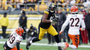 Nov 16, 2025; Pittsburgh, Pennsylvania, USA; Pittsburgh Steelers tight end Darnell Washington (80) runs with the ball against Cincinnati Bengals linebacker Barrett Carter (49) during the first half at Acrisure Stadium. Mandatory Credit: Charles LeClaire-Imagn Images
