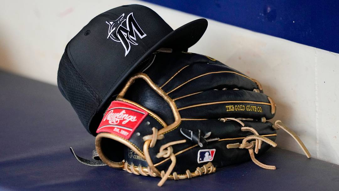 General view of a Miami Marlins hat and glove before the game against. General view of a Miami Marlins hat and glove before the game against.