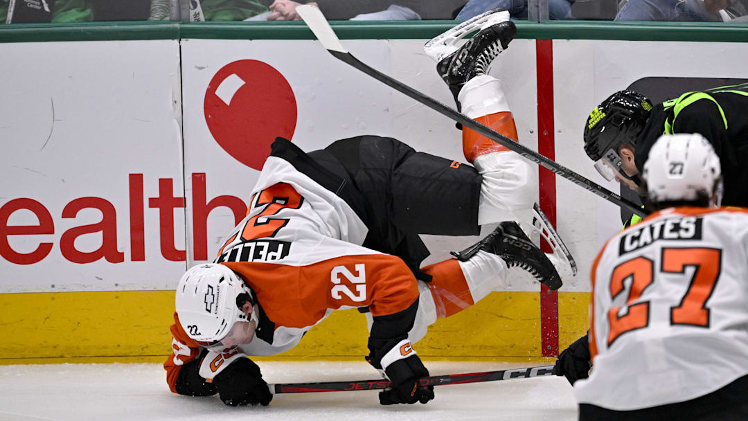 Mar 22, 2025; Dallas, Texas, USA; Philadelphia Flyers left wing Jakob Pelletier (22) falls to the ice during the first period against the Dallas Stars at the American Airlines Center.