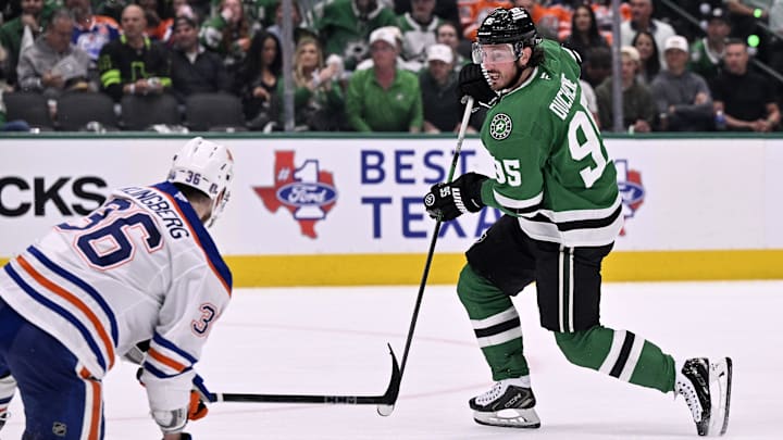 May 23, 2025; Dallas, Texas, USA; Dallas Stars center Matt Duchene (95) shoots the puck against Edmonton Oilers defenseman John Klingberg (36) in the second period for game two of the Western Conference Final of the 2025 Stanley Cup Playoffs at American Airlines Center. Mandatory Credit: Jerome Miron-Imagn Images