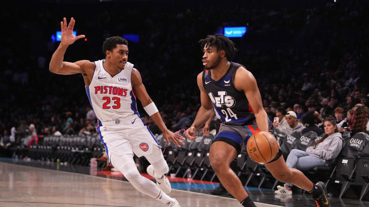 Apr 6, 2024; Brooklyn, New York, USA; Brooklyn Nets shooting guard Cam Thomas (24) dribbles the ball against Detroit Pistons point guard Jaden Ivey (23) during the second half at Barclays Center. Mandatory Credit: Gregory Fisher-USA TODAY Sports