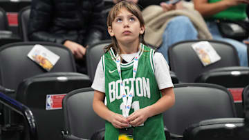 A fan looks up at the video board during the pregame warmup before a game between the Boston Celtics and the Toronto Raptors at the Scotiabank Arena.