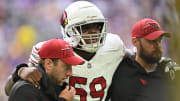 Aug 26, 2023; Minneapolis, Minnesota, USA; Arizona Cardinals guard Jon Gaines II (59) is assisted off the field by the training staff during the first quarter against the Minnesota Vikings at U.S. Bank Stadium. Mandatory Credit: Jeffrey Becker-USA TODAY Sports