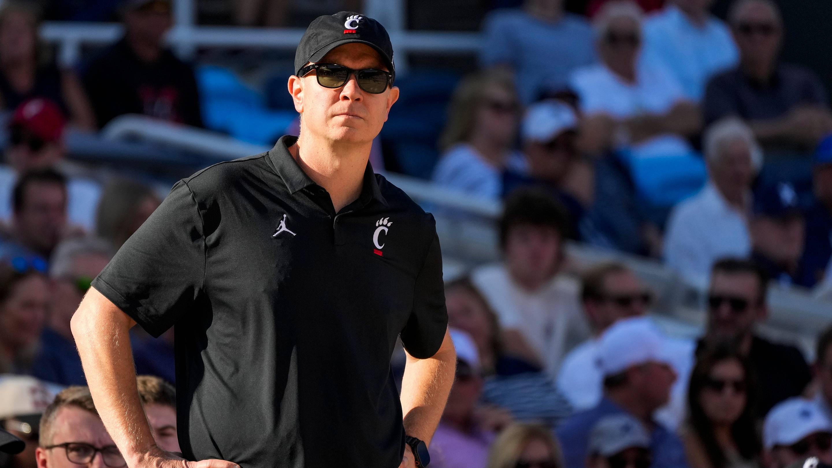 Cincinnati Bearcats head coach Jerrod Calhoun looks on from the sideline in the second half of the CareSource Invitational exhibition game between the Cincinnati Bearcats and the Ohio State Buckeyes at the Lindner Family Tennis Center in Mason, Ohio, Wednesday, Oct. 7, 2026. The Bearcats won 79-68.