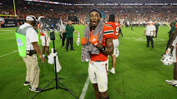 Sep 27, 2024; Miami Gardens, Florida, USA; Miami Hurricanes wide receiver Samuel Brown (11) reacts as he watches the video board from the field during an official review of the final play of the game against the Virginia Tech Hokies at Hard Rock Stadium. Mandatory Credit: Sam Navarro-Imagn Images