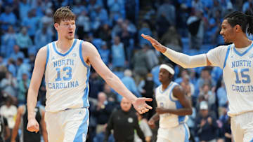 Dec 7, 2025; Chapel Hill, North Carolina, USA; North Carolina Tar Heels center Henri Veesaar (13) reacts with forward Jarin Stevenson (15) after the game at Dean E. Smith Center. Mandatory Credit: Bob Donnan-Imagn Images