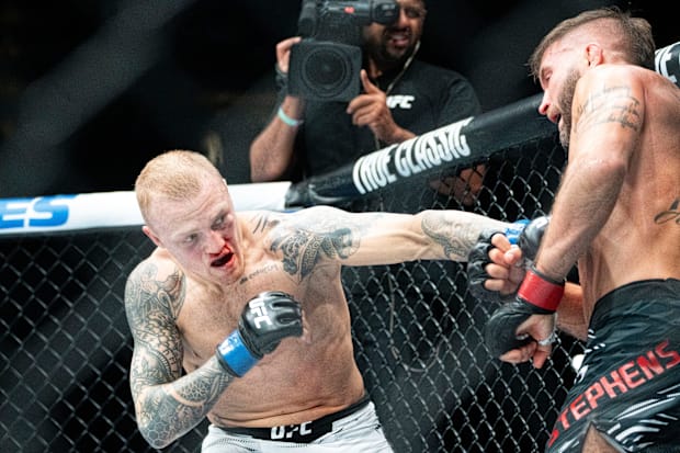Jeremy Stephens (red gloves) fights with Mason Jones (blue gloves) during UFC Fight Night at Wells Fargo Arena.