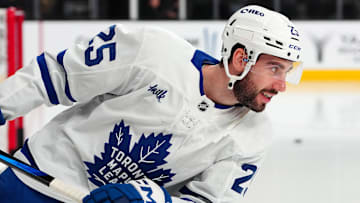 Mar 5, 2025; Las Vegas, Nevada, USA; Toronto Maple Leafs defenseman Conor Timmins (25) warms up before a game against the Vegas Golden Knights at T-Mobile Arena. Mandatory Credit: Stephen R. Sylvanie-Imagn Images