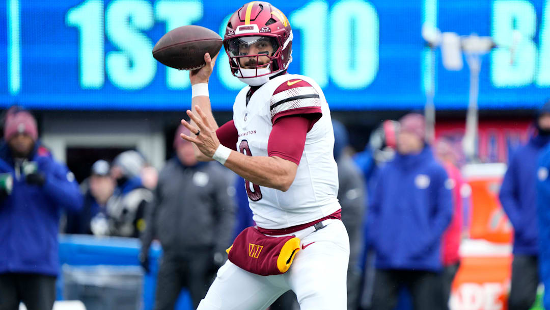 Washington Commanders quarterback Marcus Mariota (8) looks for an open teammate, Sunday, December 14, 2025, in East Rutherford.