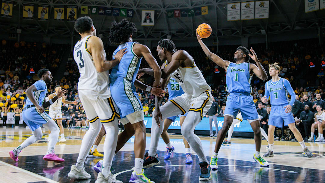 Feb 23, 2025; Wichita, Kansas, USA; Tulane Green Wave forward Kaleb Banks (1) rebounds during the first half against the Wichita State Shockers at Charles Koch Arena.