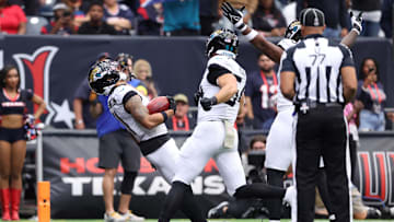 Nov 9, 2025; Houston, Texas, USA; Jacksonville Jaguars wide receiver Parker Washington (11) falls into the end zone to score a touchdown on a 72-yard punt return against the Houston Texans during the first half at NRG Stadium.