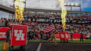 Nov 1, 2025; Houston, Texas, USA; A soldier leads the Houston Cougars out onto the field before playing against the West Virginia Mountaineers at TDECU Stadium. Mandatory Credit: Thomas Shea-Imagn Images