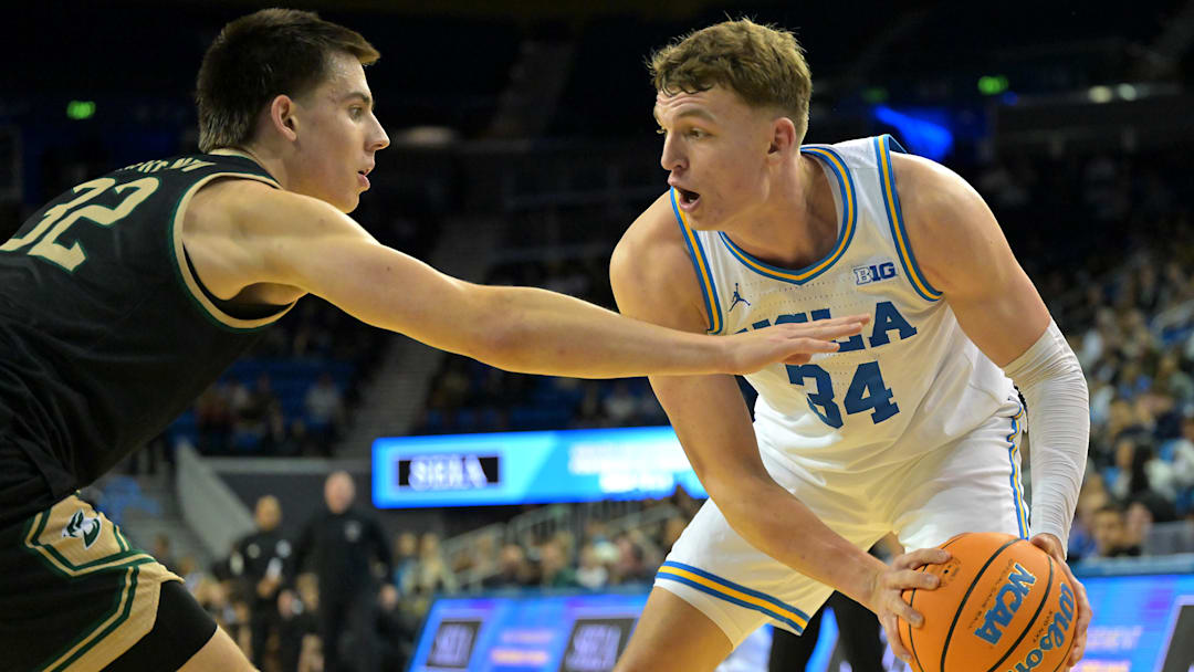 Nov 18, 2025; Los Angeles, California, USA;  UCLA Bruins forward Tyler Bilodeau (34) is defended by Sacramento State Hornets forward Mark Lavrenov (32) during the second half at Pauley Pavilion presented by Wescom Financial. Mandatory Credit: Jayne Kamin-Oncea-Imagn Images