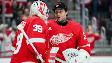 Cam Talbot (39) and Alex Lyon celebrate the Detroit Red Wings' victory over the Boston Bruins.
