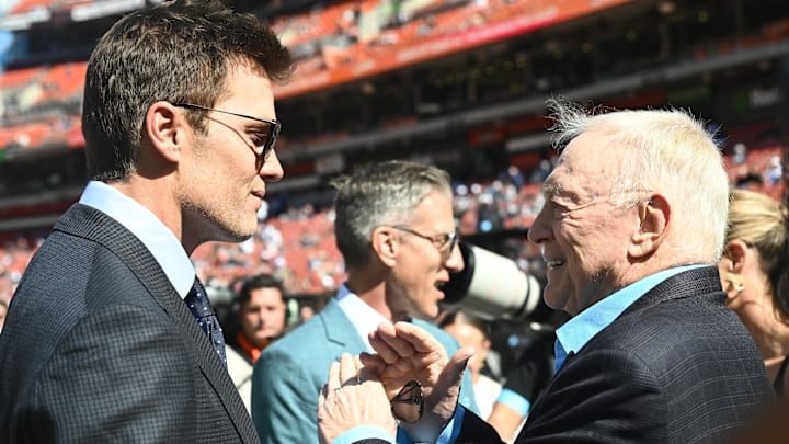 Sep 8, 2024; Cleveland, Ohio, USA; Fox Sports broadcaster Tom Brady, left, talks to Dallas Cowboys owner Jerry Jones before the game between the Cleveland Browns and the Cowboys at Huntington Bank Field. 