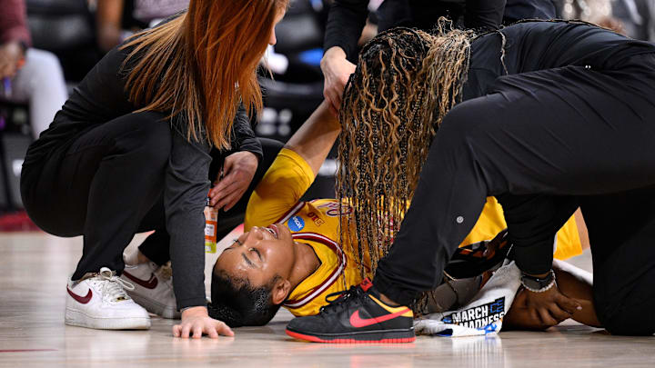 USC's JuJu Watkins is attended to after suffering a leg injury during the second round of the 2025 NCAA tournament. 