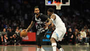 Apr 3, 2025; Brooklyn, New York, USA; Brooklyn Nets guard D'Angelo Russell (1) dribbles the ball against Minnesota Timberwolves shooting guard Anthony Edwards (5) during the first half at Barclays Center. Mandatory Credit: Gregory Fisher-Imagn Images
