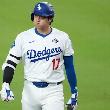 Oct 29, 2025; Los Angeles, California, USA; Los Angeles Dodgers two-way player Shohei Ohtani (17) reacts after grounding out against the Toronto Blue Jays in the eighth inning during game five of the 2025 MLB World Series at Dodger Stadium. Mandatory Credit: Kirby Lee-Imagn Images