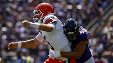 Sep 14, 2025; Baltimore, Maryland, USA;  Cleveland Browns quarterback Joe Flacco (15) is hit by Baltimore Ravens linebacker Kyle Van Noy (53) during the first quarter at M&T Bank Stadium. Mandatory Credit: Peter Casey-Imagn Images