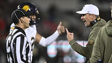 Nov 8, 2025; Louisville, Kentucky, USA;  California Golden Bears head coach Justin Wilcox talks with an official during the first half at L&N Federal Credit Union Stadium. Mandatory Credit: Jamie Rhodes-Imagn Images