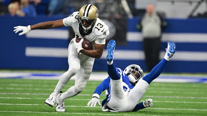 Oct 29, 2023; Indianapolis, Indiana, USA; New Orleans Saints wide receiver Michael Thomas (13) evades a tackle by Indianapolis Colts cornerback Tony Brown (38) during the first quarter at Lucas Oil Stadium. Mandatory Credit: Marc Lebryk-USA TODAY Sports