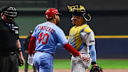 Sep 13, 2025; Milwaukee, Wisconsin, USA; Milwaukee Brewers catcher William Contreras (24) checks on his brother, St. Louis Cardinals first baseman Willson Contreras (40), after he was hit by a pitch in the first inning at American Family Field. Mandatory Credit: Benny Sieu-Imagn Images