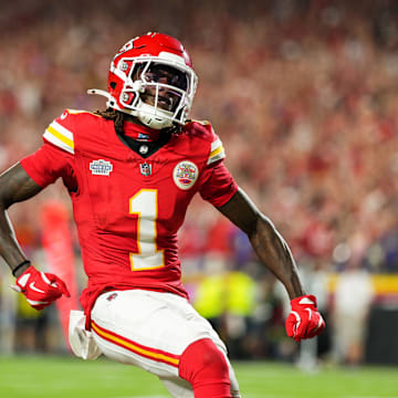 Sep 5, 2024; Kansas City, Missouri, USA; Kansas City Chiefs wide receiver Xavier Worthy (1) scores a touchdown against Baltimore Ravens safety Marcus Williams (32) during the first half at GEHA Field at Arrowhead Stadium. Mandatory Credit: Jay Biggerstaff-Imagn Images