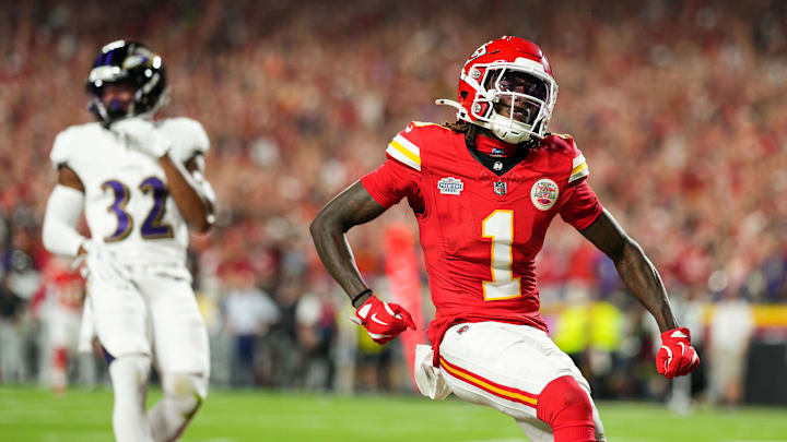 Sep 5, 2024; Kansas City, Missouri, USA; Kansas City Chiefs wide receiver Xavier Worthy (1) scores a touchdown against Baltimore Ravens safety Marcus Williams (32) during the first half at GEHA Field at Arrowhead Stadium. Mandatory Credit: Jay Biggerstaff-Imagn Images