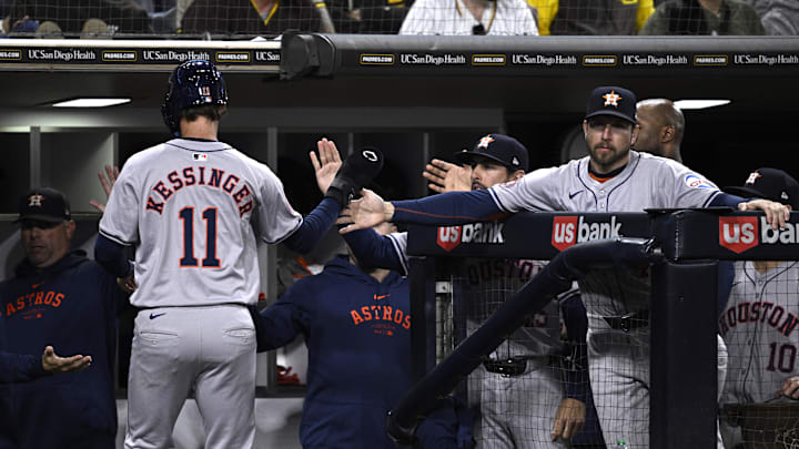 Sep 17, 2024; San Diego, California, USA; Houston Astros third baseman Grae Kessinger (11) is congratulated at the dugout after scoring a run against the San Diego Padres during the tenth inning at Petco Park. Mandatory Credit: Orlando Ramirez-Imagn Images