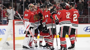 Dec 10, 2025; Chicago, Illinois, USA; The Chicago Blackhawks celebrate their win against the New York Rangers at United Center. Mandatory Credit: David Banks-Imagn Images