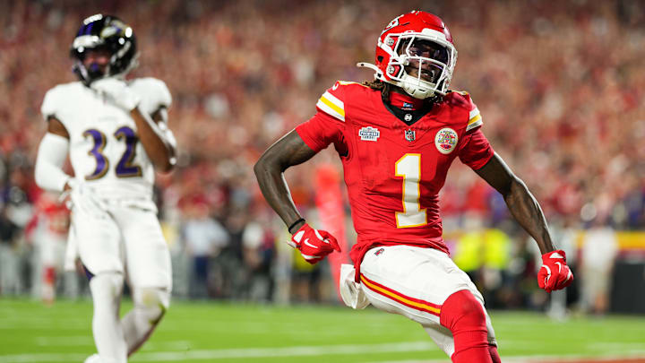 Sep 5, 2024; Kansas City, Missouri, USA; Kansas City Chiefs wide receiver Xavier Worthy (1) scores a touchdown against Baltimore Ravens safety Marcus Williams (32) during the first half at GEHA Field at Arrowhead Stadium. Mandatory Credit: Jay Biggerstaff-Imagn Images