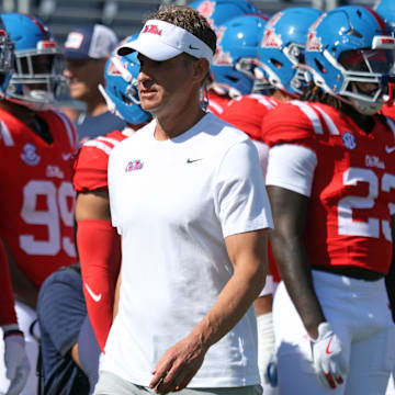 Oct 11, 2025; Oxford, Mississippi, USA; Mississippi Rebels head coach Lane Kiffin looks on during warm ups prior to the game against the Washington State Cougars at Vaught-Hemingway Stadium. Mandatory Credit: Petre Thomas-Imagn Images