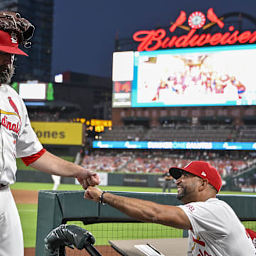 Jul 30, 2024; St. Louis, Missouri, USA;  St. Louis Cardinals starting pitcher Lance Lynn (31) is congratulated by manager Oliver Marmol (37) after the fifth inning against the Texas Rangers walks off the field after the fifth inning against the Texas Rangers at Busch Stadium. Mandatory Credit: Jeff Curry-Imagn Images