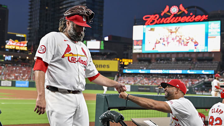 Jul 30, 2024; St. Louis, Missouri, USA;  St. Louis Cardinals starting pitcher Lance Lynn (31) is congratulated by manager Oliver Marmol (37) after the fifth inning against the Texas Rangers walks off the field after the fifth inning against the Texas Rangers at Busch Stadium. Mandatory Credit: Jeff Curry-Imagn Images