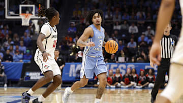 Mar 18, 2025; Dayton, OH, USA; North Carolina Tar Heels guard Elliot Cadeau (3) dribbles the ball defend by San Diego State Aztecs guard BJ Davis (10) in the second half at UD Arena. Mandatory Credit: Rick Osentoski-Imagn Images